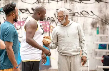  ?? QUANTRELL D. COLBERT/LIONSGATE VIA AP ?? This image released by Lionsgate shows Kyrie Irving, right, portraying Uncle Drew in a scene from the comedy “Uncle Drew.” The sports comedy also stars Lil Rel Howery (“Get Out”) and Tiffany Haddish (“Girls Trip”).