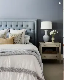  ?? ?? 6. Lamps by Circle of Light continue the main bedroom’s blue theme. Try Pottery Barn for a similar bedside table. 6