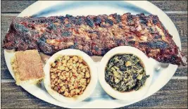  ?? DAMON HIGGINS / THE PALM BEACH POST ?? A full rack of baby back ribs with cornbread, corn, and greens prepared at PA BBQ’s location on Indiantown Road in Jupiter.