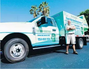  ?? MARIA LORENZINO/STAFF PHOTOGRAPH­ER ?? Spiro Edgos, through his business called The Bin Doctor, cleans peoples’ trash bins.