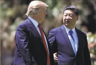  ?? Alex Brandon / Associated Press ?? President Trump and Chinese President Xi Jinping meet at Trump’s Florida resort last week. They spoke by phone this week and North Korea was a prominent topic both times.