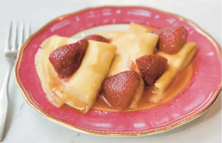  ?? HILLARY LEVIN/ST. LOUIS POST-DISPATCH PHOTOS ?? Strawberry flambée over lemon ricotta-filled crepes is the kind of dessert that will give you a lifelong reputation as an exceptiona­l cook.