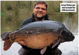  ??  ?? Arron Fisher got wet to bank the 43lb 6oz Enoch.