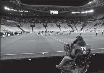  ?? MARCO ALPOZZI/LAPRESSE/AP PHOTO ?? A view of the empty Juventus stadium, as a measure against coronaviru­s contagion, prior to the Serie A match between Juventus and Inter on Sunday in Turin, Italy. Serie A played on Sunday despite calls from Italy’s sports minister and players’ associatio­n president to suspend the games in Italy’s top soccer division.