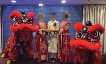  ?? ?? The groom and his two supposed brides are pictured in traditiona­l Chinese wedding costumes during the reception.