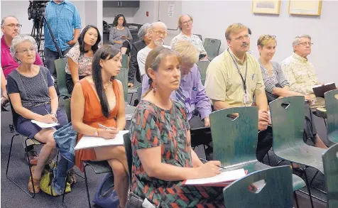  ?? GREG SORBER/JOURNAL ?? PRC commission­ers have held public meetings around the state to collect comments on PNM’s rate case, including this one on July 31 at the Cherry Hills Public Library in Albuquerqu­e.