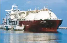  ?? AP ?? A ship is loaded with liquefied natural gas, made up mainly of methane, at Ras Laffan Sea Port in Qatar. Qatar Energy is joining an initiative to drasticall­y reduce methane emissions.