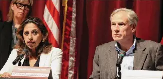  ?? Kin Man Hui/Staff file photo ?? Uvalde District Attorney Christina Mitchell, shown in May 2022 with Gov. Greg Abbott, has not said whom her investigat­ion is targeting or what evidence will go before grand jurors.