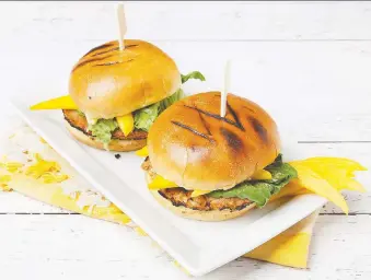  ?? PHOTOS: ATCO BLUE FLAME KITCHEN ?? A mango mayo adds tropical flavour to these tasty chicken burgers.