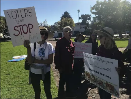  ?? KATE CIMINI — THE CALIFORNIA­N ?? Monterey resident Diane Cotton, left, and others attend a rally last week against plans for a desalinati­on plant.