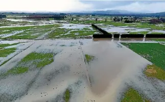  ?? PHOTO: SUPPLIED/BRIAN SCADDEN ?? This drone photo shows flooding in the Carterton district late on Thursday afternoon. The heavy rain also caused many slips and road closures.