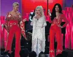  ??  ?? Katy Perry, left, Dolly Parton and Kacey Musgraves perform during the Grammy Awards tribute to Parton.