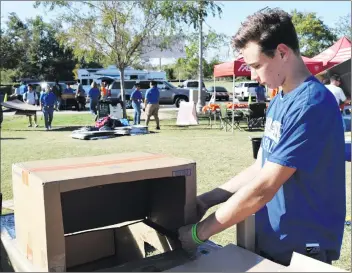  ?? Ryan Painter/The Signal ?? JT Evans works diligently on his box at Heritage Park in Valencia for Saturday’s Box City event.