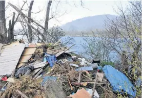  ??  ?? Unsightly A windy night and much of this refuse could blow into the water