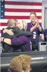  ?? Picture: PA. ?? Project manager at JPL, Dr Earl Maize, and operations team manager for the mission, Julie Webster, embraced after the spacecraft plunged into Saturn.