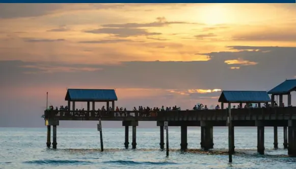  ?? COLIN MILLER ?? Fishing at Pier 60 at Clearwater Beach in Florida also offers the chance to catch a spectacula­r sunset over the water. The pier is open 24-7 nine months of the year.