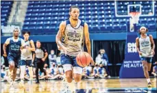  ?? URI Athletics ?? Ishmael El-Amin, son of former UConn star Khalid El-Amin, dribbles during Rhode Island’s Blue-White scrimmage.