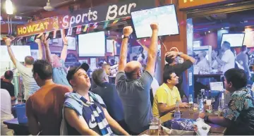  ??  ?? fans reacting as they watch the 2018 Russia World Cup match between France and Argentina at a bar in Manila in this June 30 file photo. — AFP photo