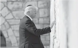  ?? Evan Vucci / Associated Press ?? President Donald Trump visits Jerusalem’s Western Wall, the first sitting U.S. president to do so.