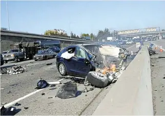  ?? SEngleman /Handout via Reuters ?? Litmus test: A Tesla Model X, which crashed on U.S. Highway 101, is seen in Mountain View, California, on March 23, 2018 in this handout image.
/