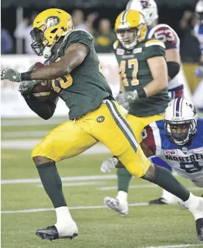  ?? ED KAISER ?? Eskimos’ Deon Lacey makes an intercepti­on and runs for a touchdown with under one minute left to play last week against the Montreal Alouettes.