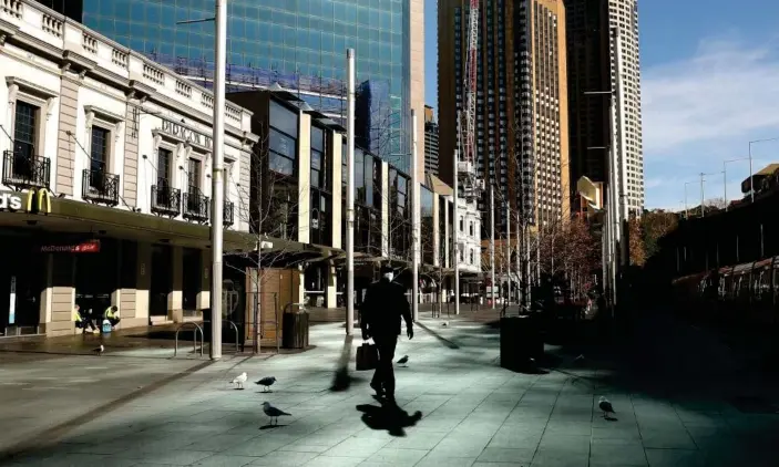  ?? Photograph: Brendon Thorne/AFP/Getty Images ?? Sydney’s central business district during the state’s lockdown. The support package will increase payments for workers who have lost work.