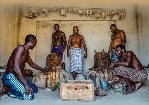  ?? Photo: AFP ?? Vodun dignitarie­s attend a voodoo ritual in a Zangbeto convent in Guezin, as part of the annual voodoo festival on Sunday in Benin.