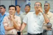  ?? PTI PHOTO ?? Investors watch the stock prices at a screen outside the Bombay Stock Exchange in Mumbai on Monday.