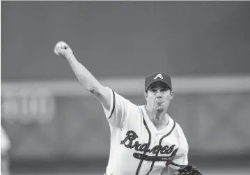  ?? JAMIE SQUIRE Getty Images/TNS ?? Former Braves pitcher Greg Maddux, seen in 2002, believes pitchers today are encouraged too much to go for velocity rather than location.