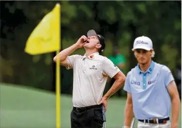  ?? CURTIS COMPTON/CURTIS.COMPTON@AJC.COM ?? Justin Rose reacts to a missed eagle putt on the eighth hole during the third round Saturday at Augusta National while he was paired with Will Zalatoris. Rose trails Hideki Matsuyama by four shots.