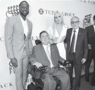  ?? BRYAN BEDDER Getty Images for The Buoniconti Fund To Cure Paralysis ?? From left, Dwyane Wade, Marc Buoniconti, Lindsey Vonn, and Dr. Barth Green attend the Great Sports Legends Dinner to Benefit The Buoniconti Fund to Cure Paralysis on Monday.