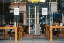  ?? Mark Mulligan / Staff photograph­er ?? Apple announced on its website that it plans to start reopening some of its Houston-area stores as early as Sunday.