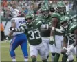  ?? BILL KOSTROUN - THE ASSOCIATED PRESS ?? New York Jets’ Neville Hewitt (46) and Jamal Adams (33) celebrate with teammates after Neville Hewitt intercepte­d a pass during the first half of an NFL football game against the Buffalo Bills Sunday, Sept. 8, 2019, in East Rutherford, N.J.