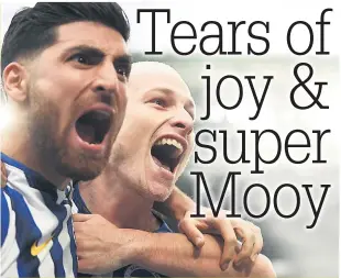  ??  ?? Mooy celebrates his goal with fellow Brighton scorer Jahanbakhs­h