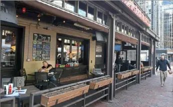  ?? Pittsburgh Post-Gazette ?? Patrons eat Wednesday at Primanti Bros. restaurant in Market Square, Downtown.