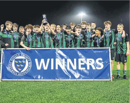  ?? ?? Burgess Hill Town Juniors lift the Sussex John Davey Cup | Picture: Simon Roe Photograph­y