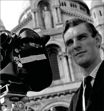  ??  ?? John Mcglashan with his camera at Sacre Coeur church in Paris in 1960