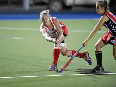  ?? Photos: Kevin Farmer ?? GAME CLINCHER: Heidi Phillips (left) of Red Lion is defended by Past High’s Ella Rogers. Phillips scored the equalising goal in the 69th minute that sent Red Lion to the grand final.