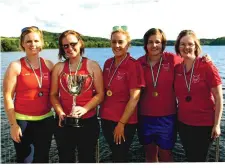  ??  ?? The Lough Arrow Women’s crew, winners of the Ladies Senior Race with the Della McGowan Stanford Memorial Cup.