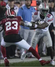  ?? (AP/AJ Mast) ?? Ohio State wide receiver Marvin Harrison (right) was an Associated Press first-team All-American this season, leading the Buckeyes with 72 catches for 1,156 yards and 12 touchdowns.