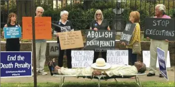  ??  ?? Pulaski County Circuit Judge Wendell Griffen takes part of an anti-death penalty demonstrat­ion outside the Governor’s Mansion on Friday in Little Rock, Ark. SHERRY SIMON VIA AP