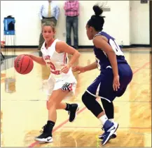  ?? LARRY GREESON / For the Calhoun Times ?? Sonoravill­e’s Harleigh Chastain (left) dribbles around Cartersvil­le’s A’Mya Davis during the first half on Tuesday.