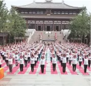  ??  ?? Participan­ts attend a yoga event organised by the SCO in Beijing on Saturday