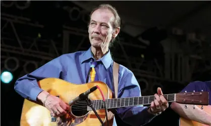  ??  ?? Tony Rice on stage in 2009 with his customary Martin D-28. Photograph: Jason Merritt/Term/FilmMagic