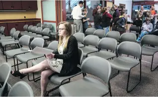  ??  ?? Moriah Engdahl waits for her turn to address the school board on the subject of arming teachers.