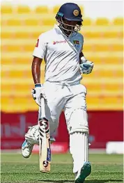  ??  ?? Ace hitter: Sri Lanka’s Dimuth Karunaratn­e running between the wickets after scoring a century against Pakistan yesterday. — AFP