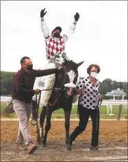  ?? Al Bello / TNS ?? Tiz the Law, with Manuel Franco up, wins the 152nd running of the Belmont Stakes at Belmont Park in Elmont, N.Y., on Satuday.