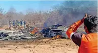  ?? — pti ?? Locals near the wreckage of jets after a SU-30MKI and a Mirage 2000 fighter planes crashed during an exercise in Morena district on Saturday.