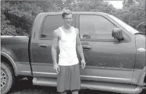  ?? PHOTO FROM MCDONALD COUNTY EMERGENCY MANAGEMENT DEPARTMENT FACEBOOK PAGE ?? Wade Woods is shown standing in front of the pickup truck he was last seen driving after a man was shot in Longview. He was arrested Tuesday night.