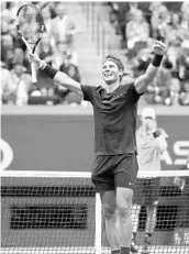  ?? ELSA/GETTY IMAGES ?? Spain’s Rafal Nadal celebrates after beating South Africa’s Kevin Anderson Sunday to win his third U.S. Open title.